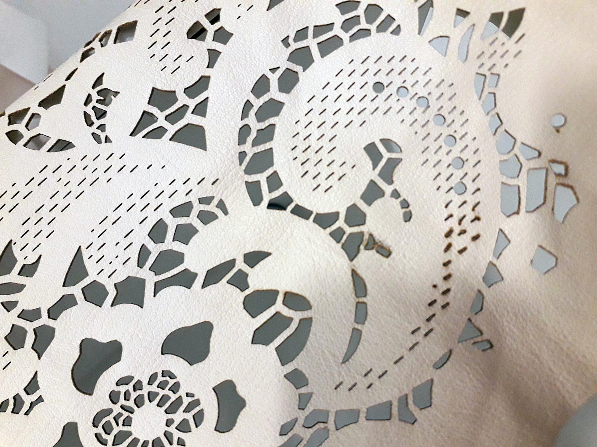 IMMAGINE COVER TAGLIO LASER